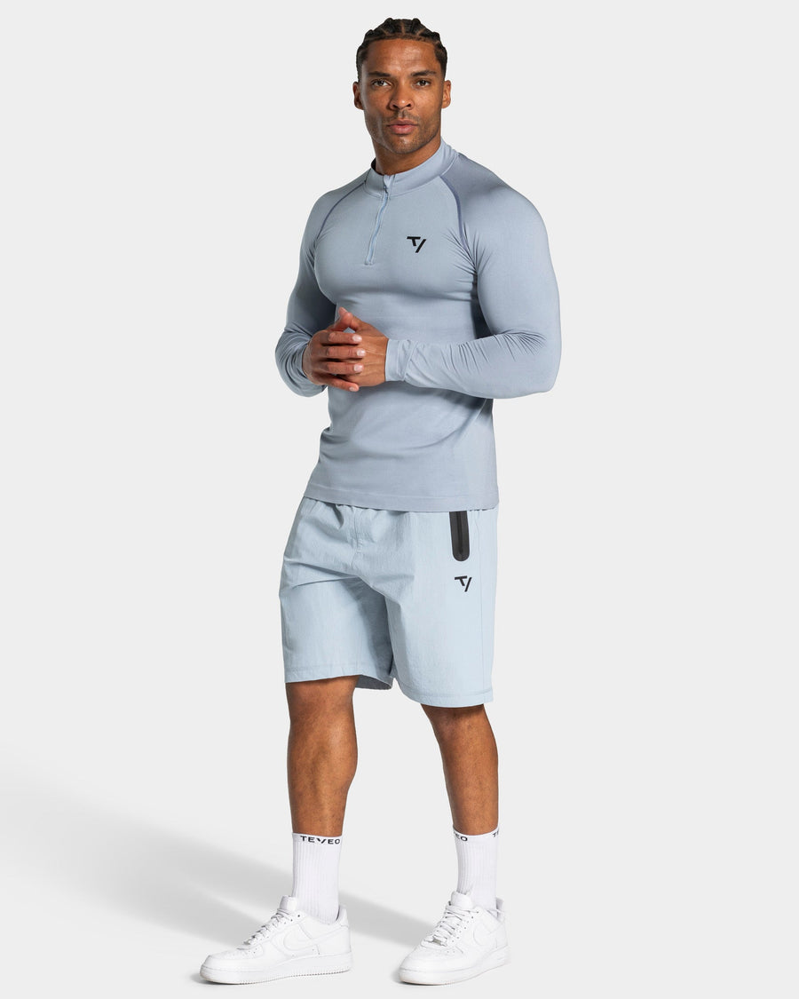 Haut à manches longues demi-zippé Workout sans coutures « bleu acier »